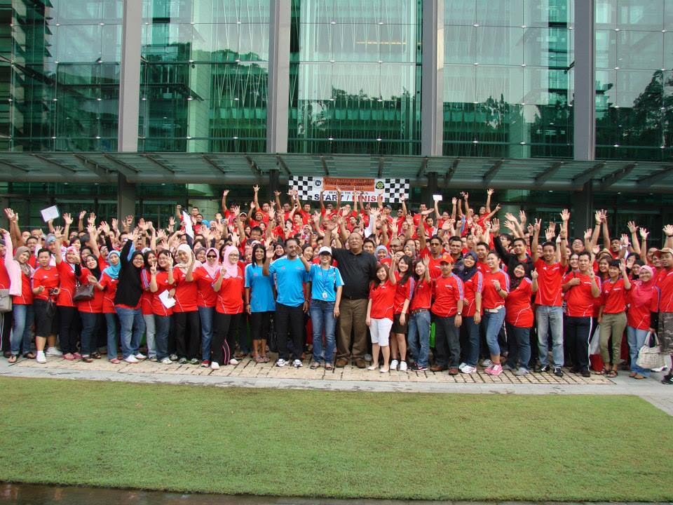 Employees celebrating successful teamwork during a GEM Treasure Hunt programme